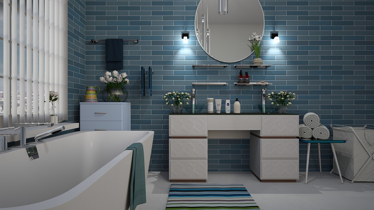 New white bathtub with a tiled surround and shower fixtures